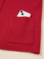 👗 Gilet enveloppant avec col et poches pratiques - Vue de trois-quarts illustrant le style raffiné et professionnel