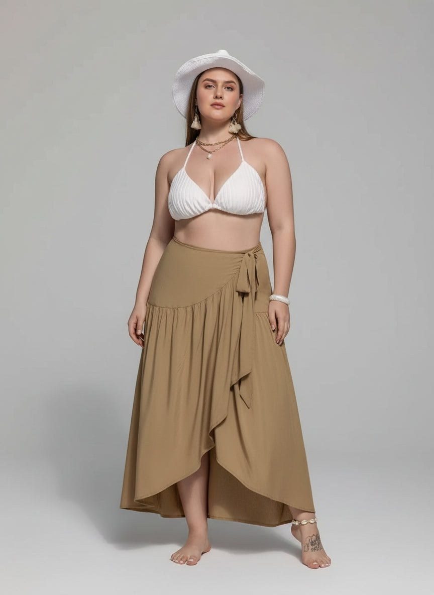💫 Jupe grande taille portée en mouvement - Ensemble montrant le mouvement gracieux de l'ourlet asymétrique en action, ceinture à nouer ajustée à la taille, silhouette féminine élégante et confiante, style moderne sophistiqué
