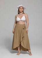 💫 Jupe grande taille portée en mouvement - Ensemble montrant le mouvement gracieux de l'ourlet asymétrique en action, ceinture à nouer ajustée à la taille, silhouette féminine élégante et confiante, style moderne sophistiqué
