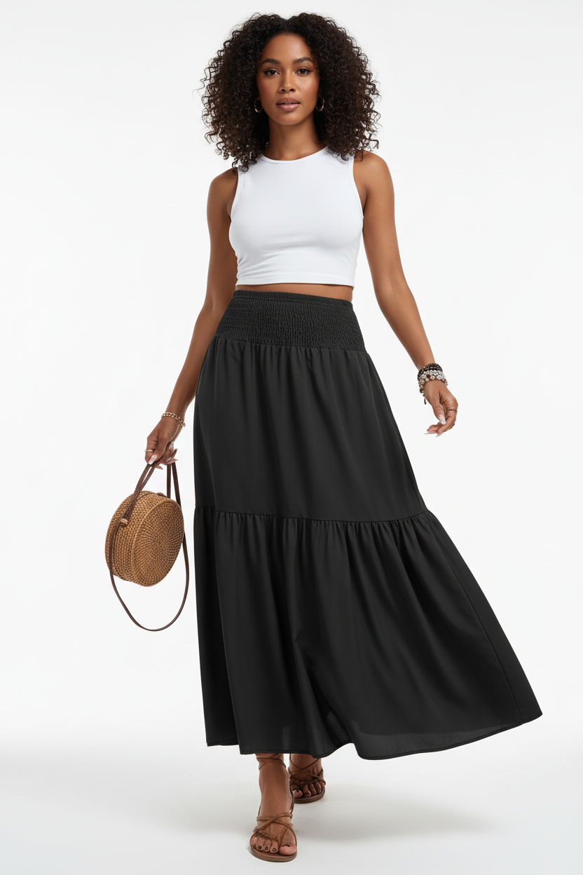 Jupe longue smockée à volants Black-Coat - mannequin capturée en pleine marche sur fond blanc studio, montrant le mouvement naturel et fluide du volant étagé, l'élégance décontractée en mouvement, le tombé parfait du tissu léger et la taille smockée confortable