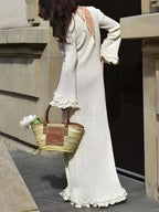 Robe pull manches longues ourlet à volants - vue arrière détaillant la finition soignée et la texture côtelée flatteuse - BLACK-COAT
