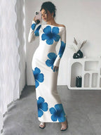 Robe maxi imprimé floral épaule asymétrique BLACK-COAT - vue de face montrant la découpe asymétrique audacieuse, l'imprimé floral romantique, les détails froncés sophistiqués et la longueur maxi élégante parfaite pour occasions spéciales
