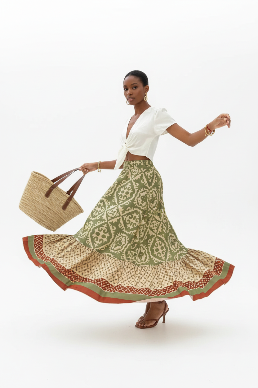 Jupe longue bohème Black-Coat à imprimé géométrique avec volants étagés et bordure contrastée - mannequin en mouvement de rotation tournoyant sur fond blanc studio, capturant le mouvement spectaculaire des trois étages de volants qui s'évasent, l'effet romantique et aérien de la jupe en mouvement et la beauté de l'imprimé géométrique qui danse