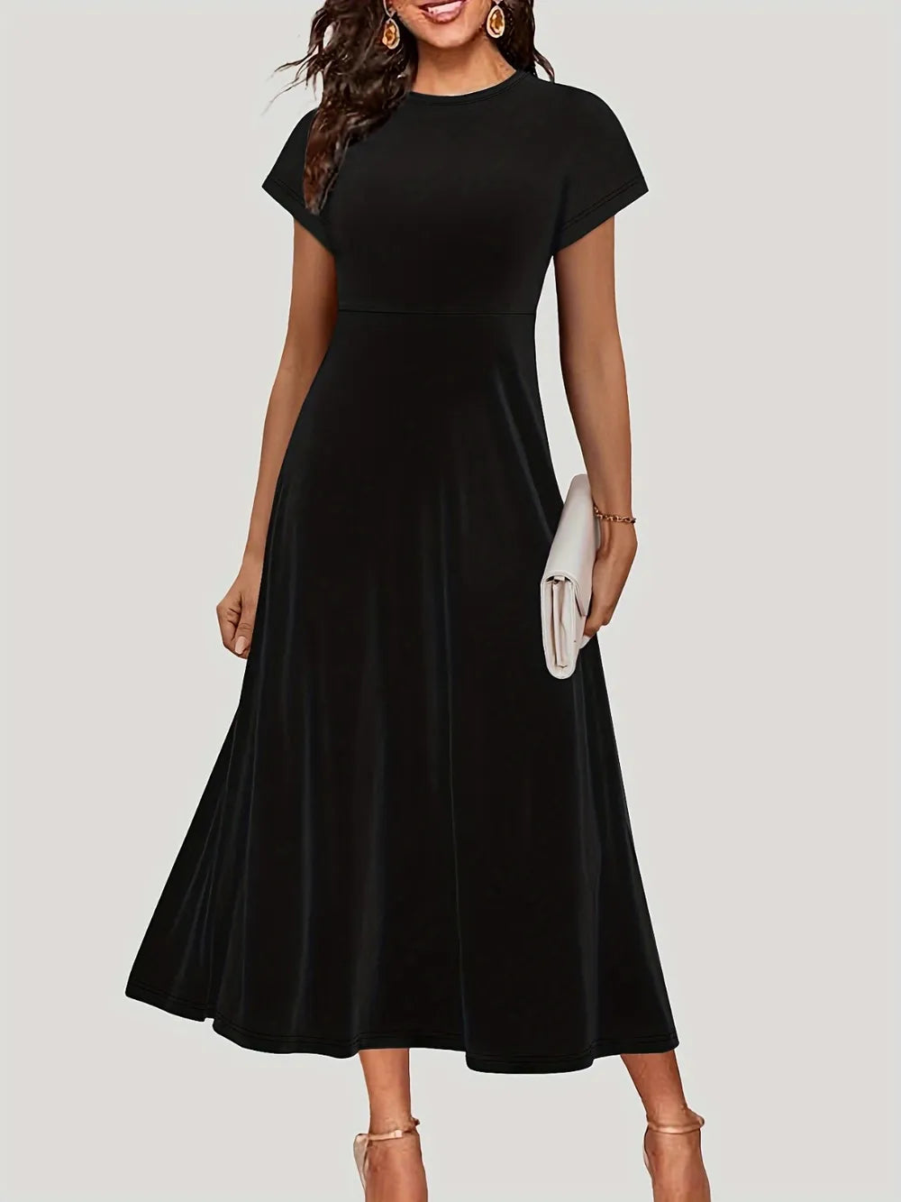 Robe midi classique à encolure ronde, manches courtes élégantes, silhouette fluide et intemporelle, coupe flatteuse, style polyvalent jour-soir, design sophistiqué et féminin
