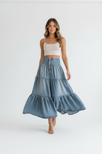  Jupe denim étagée à boutons jean volants bleu clair - vue en mouvement montrant les volants étagés créant mouvement élégant féminin, drapé fluide du tissu rayonne, grâce bohème en action - BLACK-COAT