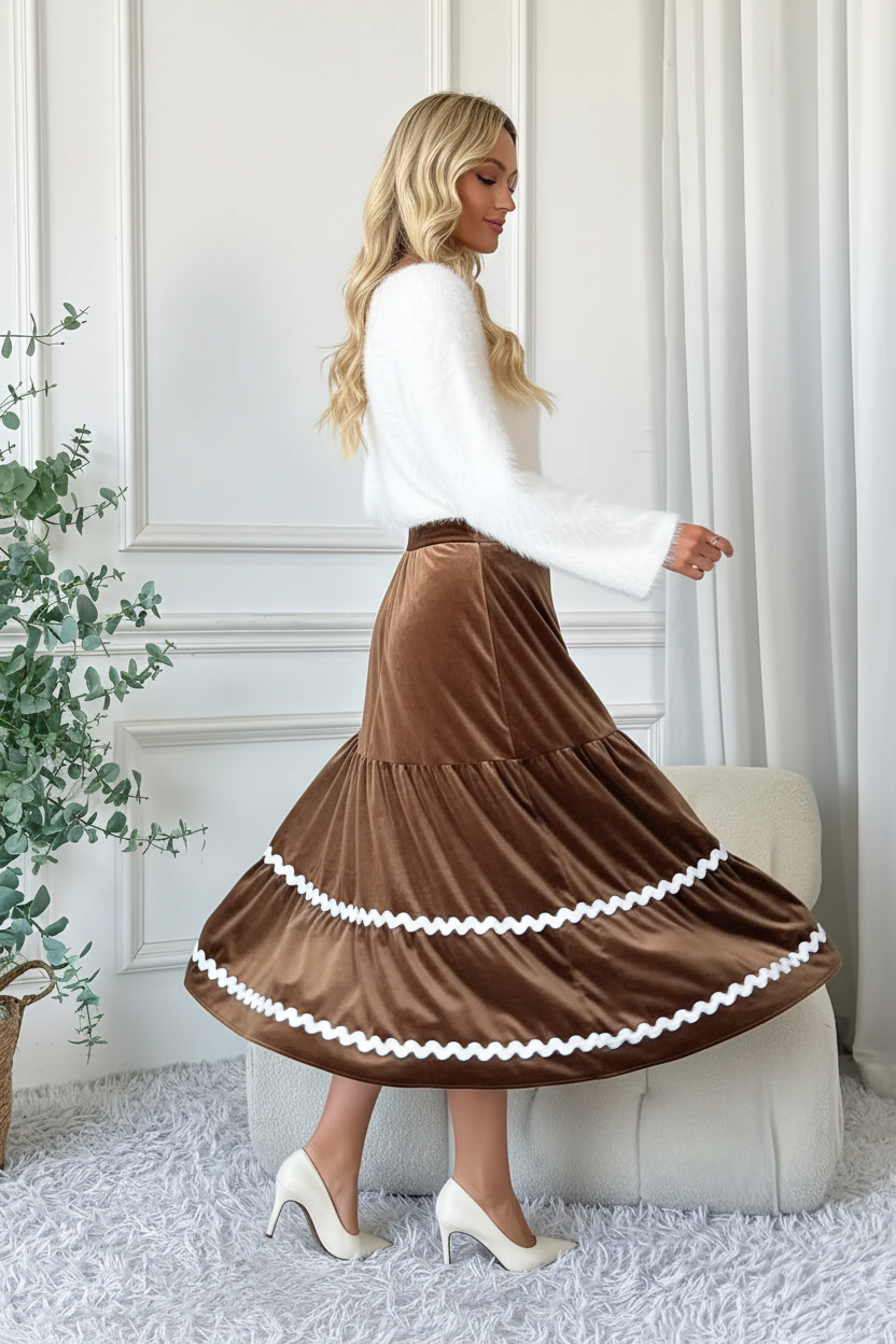 Jupe midi velours marron volants étagés en mouvement montrant les volants fluides en twirl, la texture velours luxueuse et le style élégant sophistiqué - BLACK-COAT