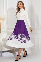 Jupe midi ligne A imprimé floral violette - vue frontale-latérale capturant la marche dynamique avec silhouette A-line s'évasant gracieusement et bordure florale blanche en mouvement style féminin - BLACK-COAT