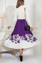 Jupe midi ligne A imprimé floral violette - vue arrière montrant mannequin s'éloignant avec silhouette A-line bordure florale blanche et flux élégant de la jupe midi - BLACK-COAT
