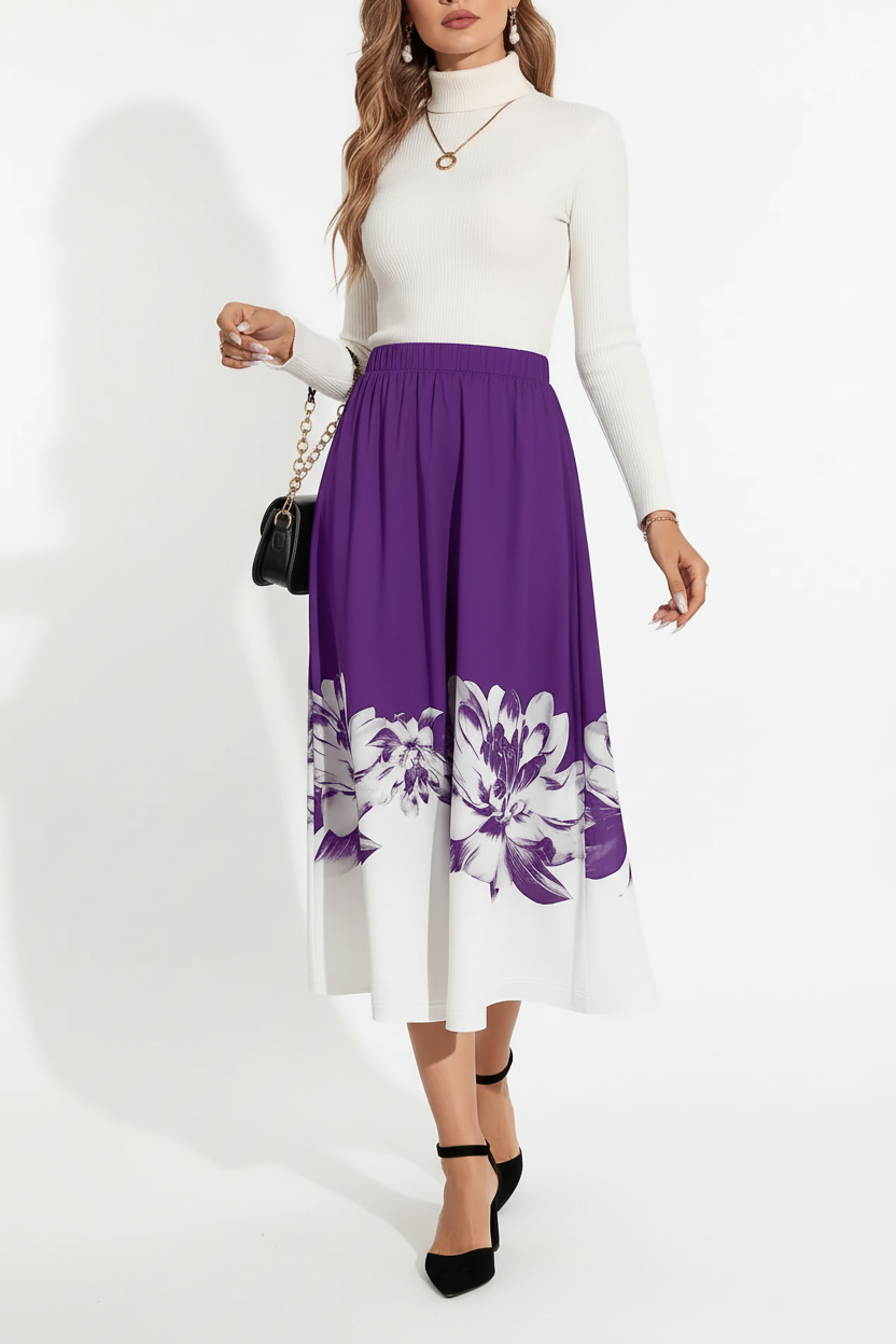 Jupe midi ligne A imprimé floral violette - vue de face montrant mannequin en mouvement de marche naturelle avec couleur violette vibrante bordure motif floral blanc à l'ourlet silhouette A-line s'évasant gracieusement et longueur midi - BLACK-COAT