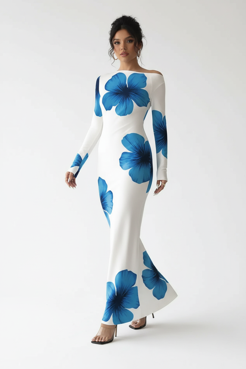 "Robe maxi blanche imprimé floral bleu épaule asymétrique - en marche mouvement naturel montrant la robe portée en mouvement, ourlet maxi qui bouge élégamment, imprimé floral bleu vibrant, silhouette dynamique chic, fond blanc studio BLACK-COAT"
