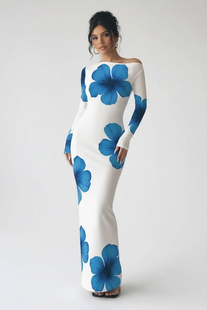 "Robe maxi blanche imprimé floral bleu épaule asymétrique - pose décontractée naturelle montrant l'élégance bohème de la tenue, décolleté asymétrique one-shoulder, imprimé floral audacieux bleu, silhouette moulante, style estival chic, fond blanc studio BLACK-COAT"