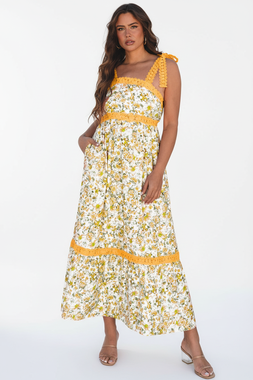 Robe maxi imprimé floral jaune pose décontractée montrant le style champêtre chic, les détails crochet et la silhouette flatteuse - BLACK-COAT